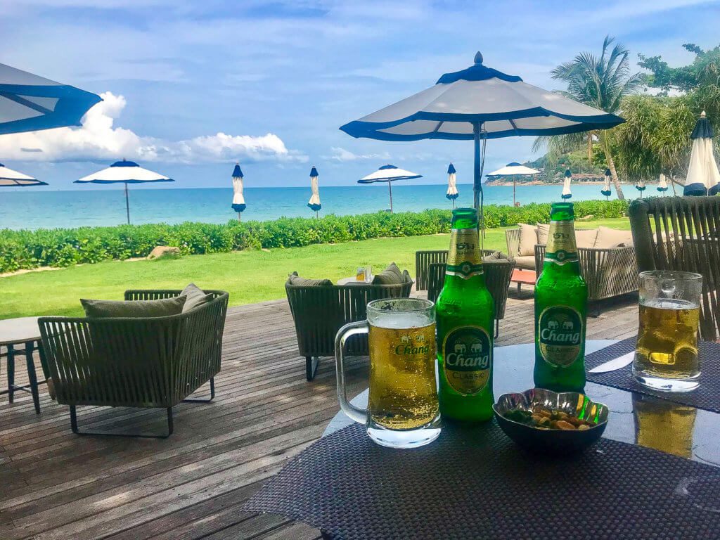 Save money by drinking local Chang Beer at beach of Vana Belle resort Koh Samui Thailand