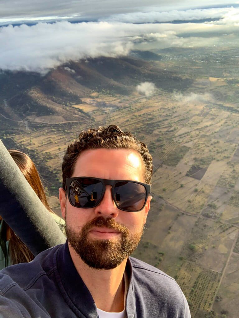 selfie of man in hot air balloon near teotihuacan pyramids in mexico 