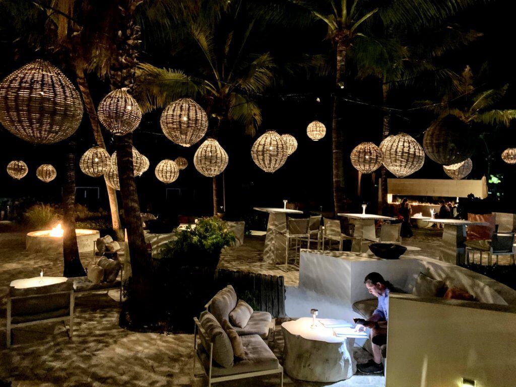 lanterns hanging from trees at infiniti bar turks and caicos