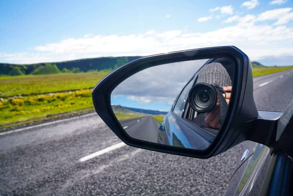 picture of car mirror while driving in iceland 